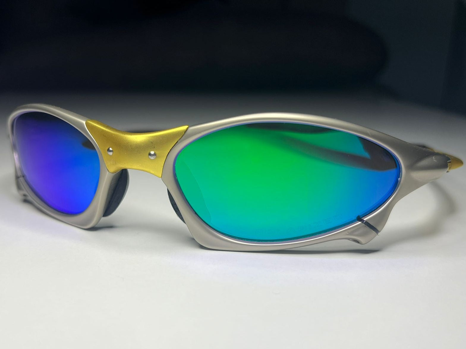 Axiom- Titanium/Gold Frame- Blue/Green Lenses- Polarized
