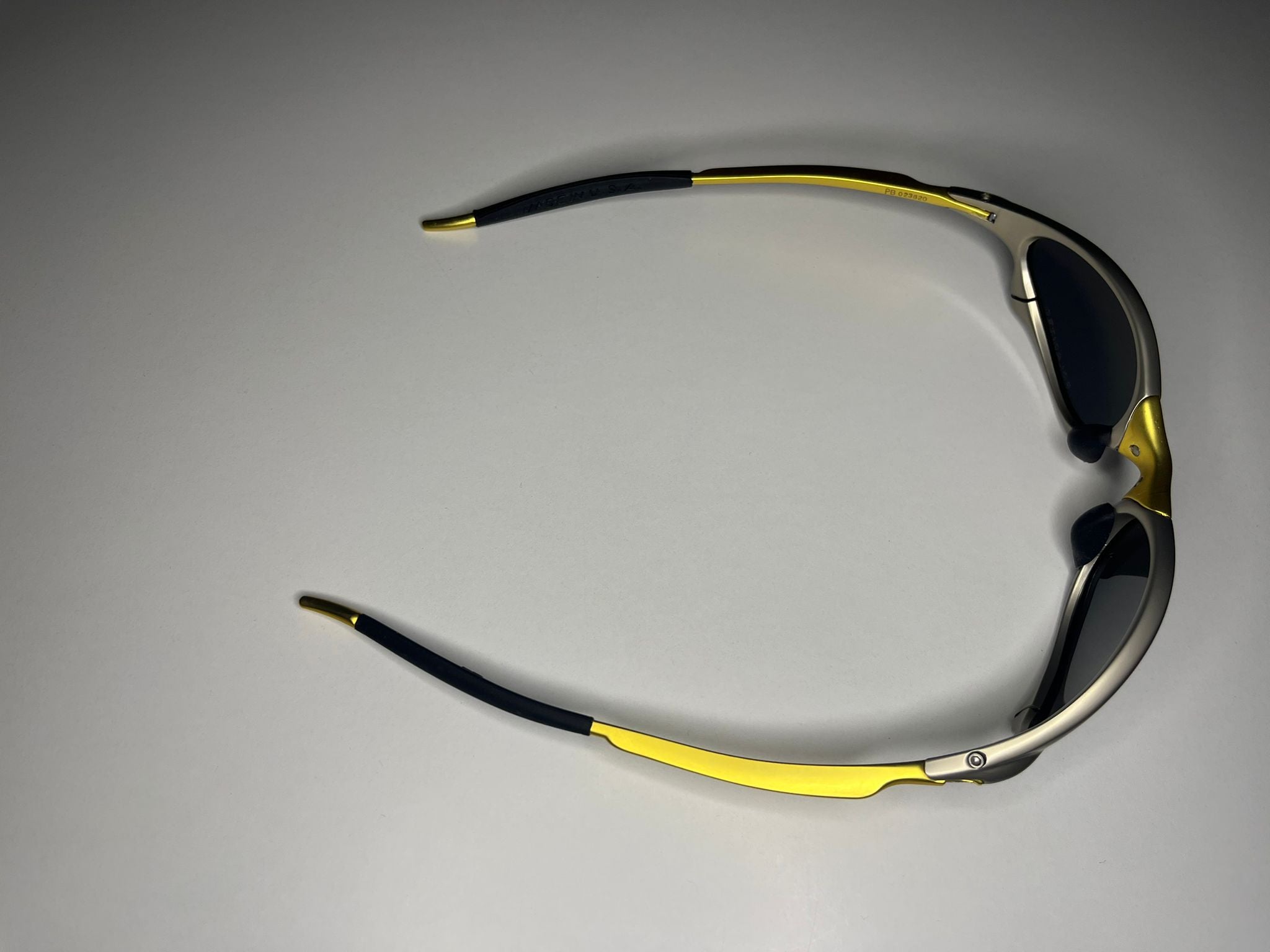 Axiom- Titanium/Gold Frame- Blue/Green Lenses- Polarized