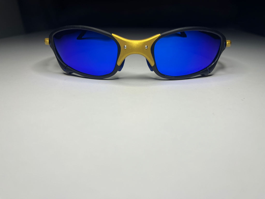 Resolute- 24K Gold and Black Frames- Metallic Blue Lenses Polarized