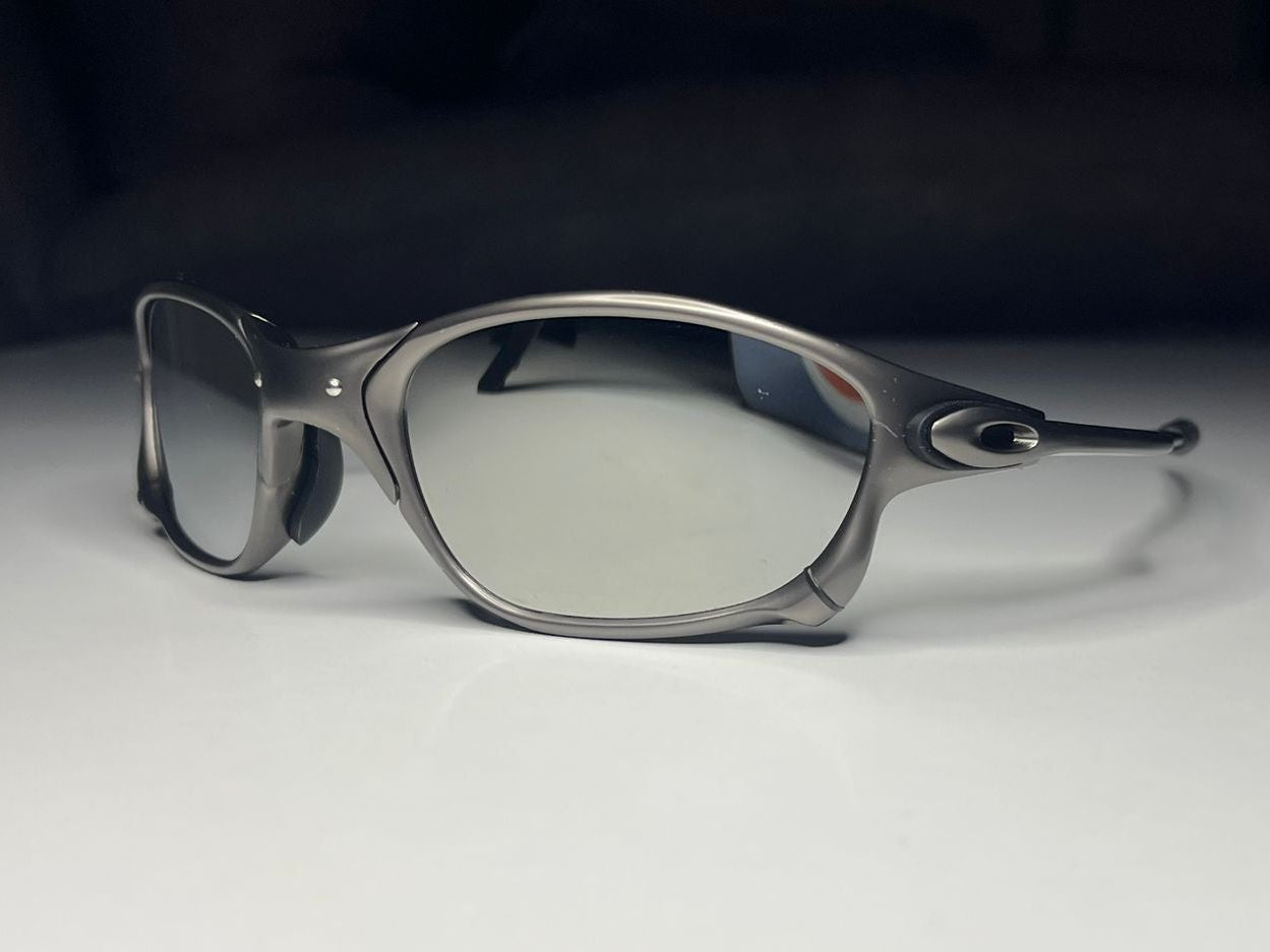 Sunglasses on a white surface with a dark background