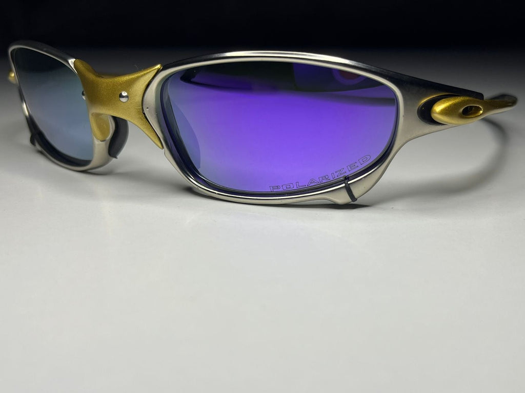 Sunglasses with gold and silver frame on a white background