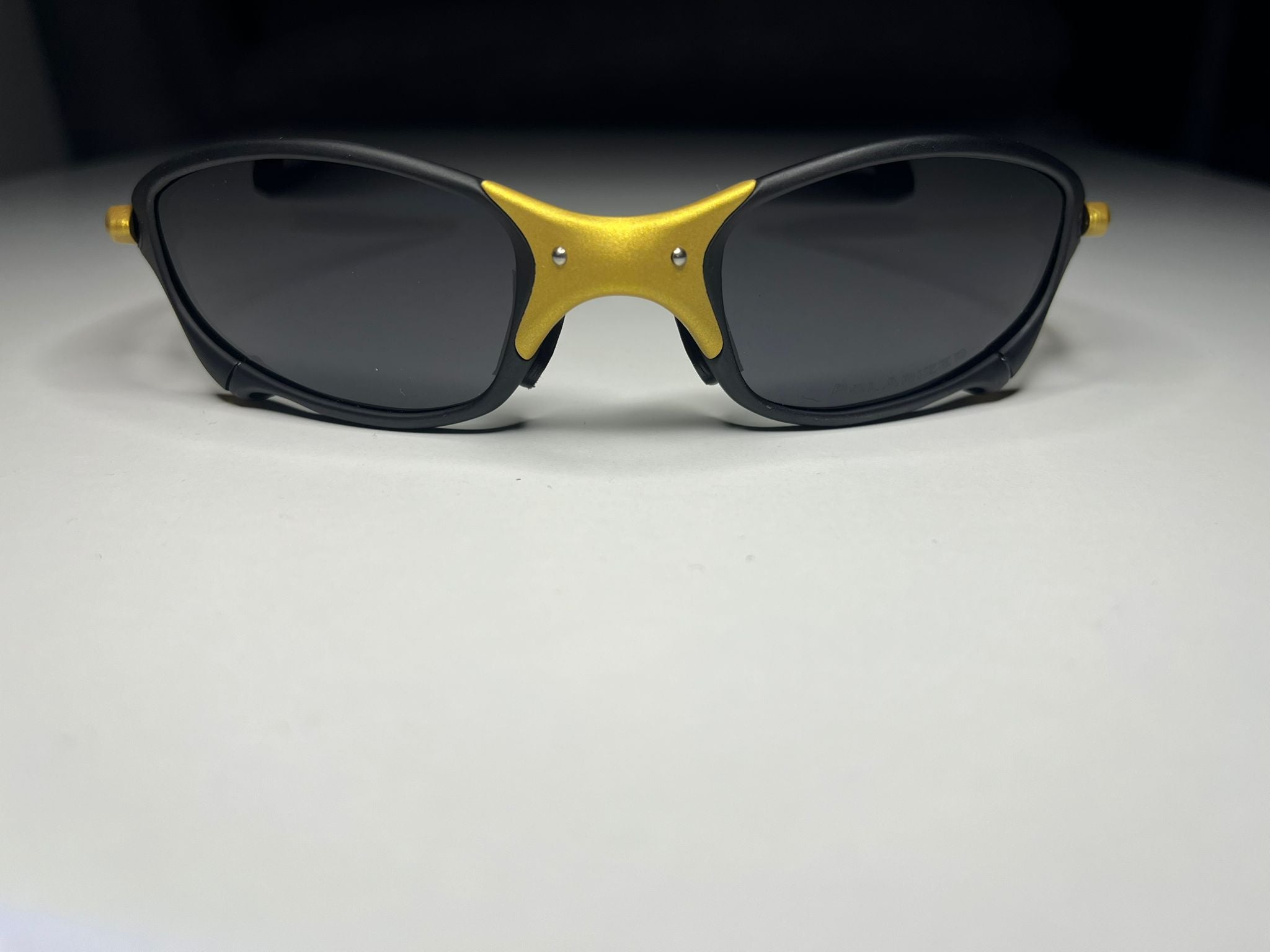Resolute- Black and Gold Frame- Gray/Black Lenses- Polarized
