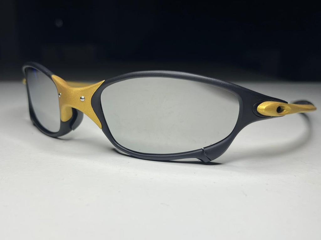Black and gold eyeglasses on a white background